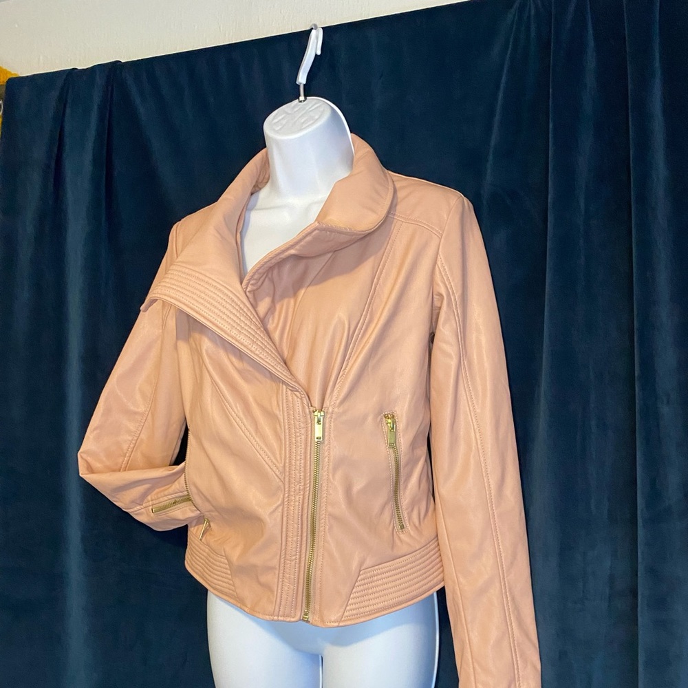 Women leather jacket, soft pinkish in color.